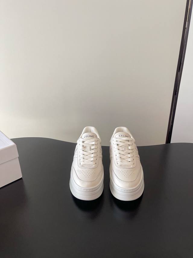 Celine's latest thick-soled, retro Trainer white sneakers ( ) are now available.