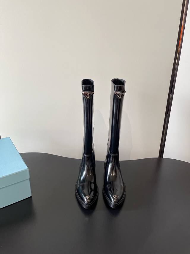 Prada's latest pointed-toe boots, thick-soled motorcycle boots, are stylish and