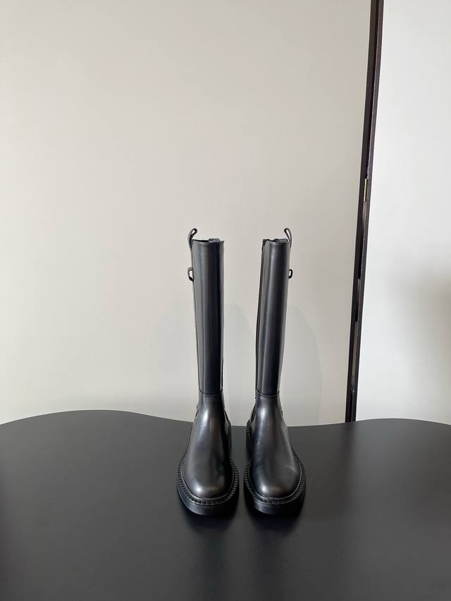 Prada's latest Chelsea elasticated boots, thick-soled motorcycle boots, are sty