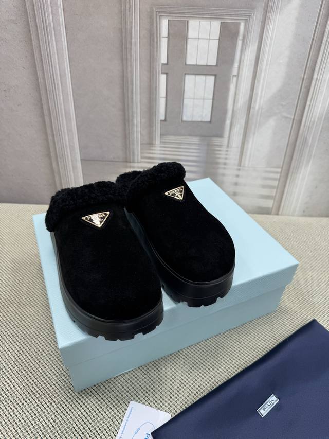 Top-of-the-line Prada's latest retro triangle-label sneakers. Originally source