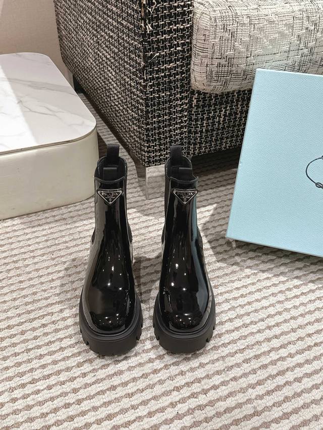 prada's latest autumn and winter triangle-label slip-on boots . A collection no