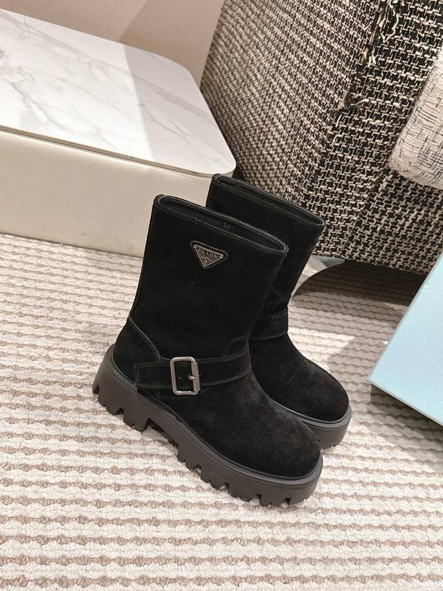 Premium Edition Prada's classic triangle-shaped platform slip-on boots for Fall/