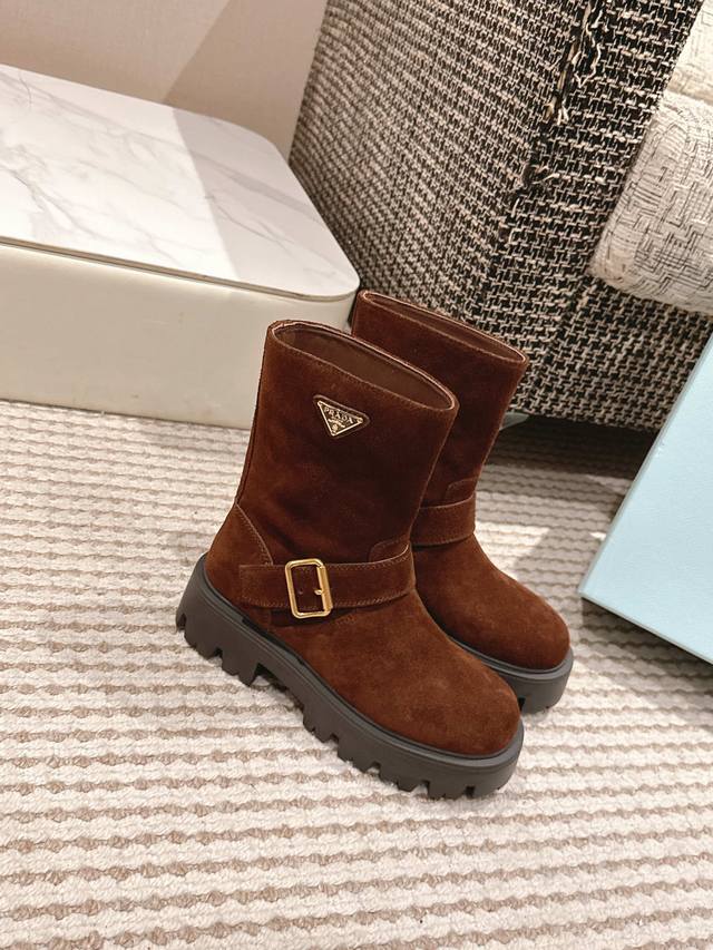 Premium Edition Prada's classic triangle-shaped platform slip-on boots for Fall/