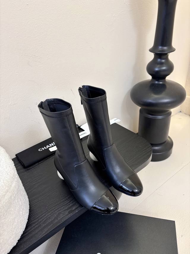Chanel | Chanel's classic fall/winter stretch boots. These are the most comforta