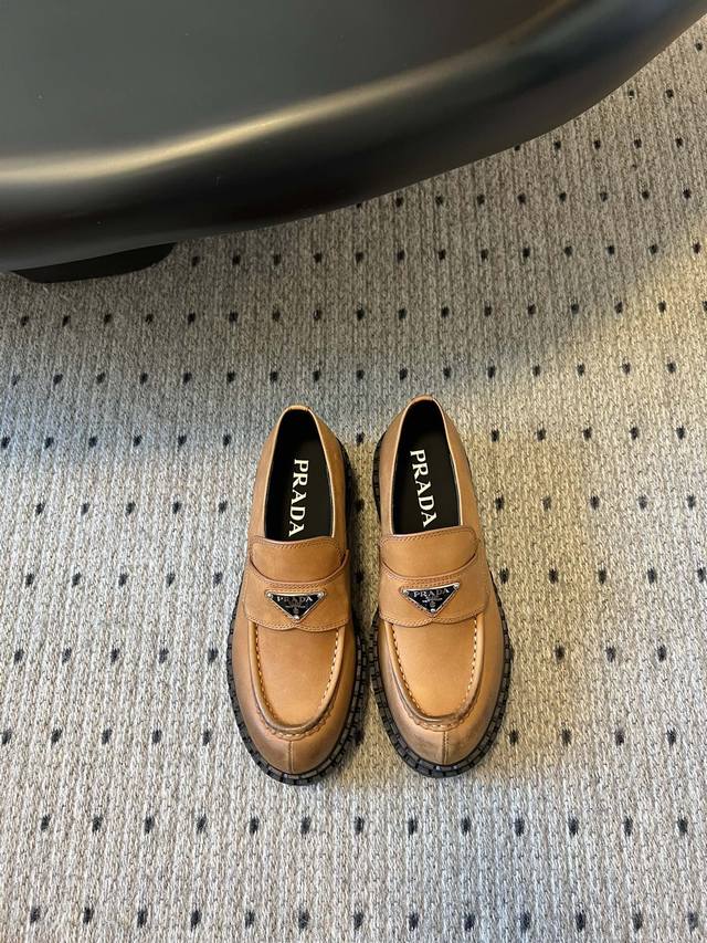 prad* Prada's soft leather platform loafers with classic triangle logos. The new