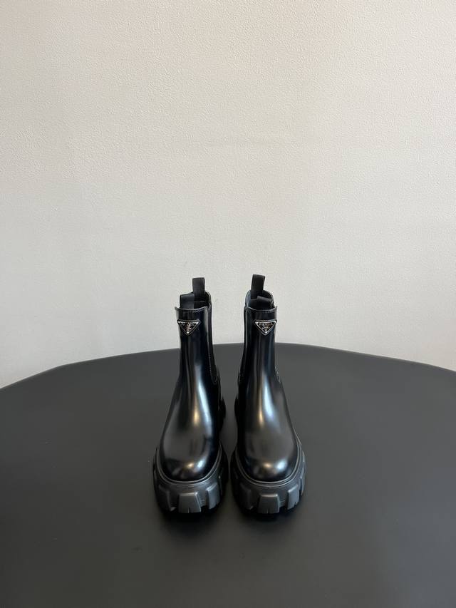 prad* It's hard not to love Prada's new thick-soled Chelsea boots . This new on