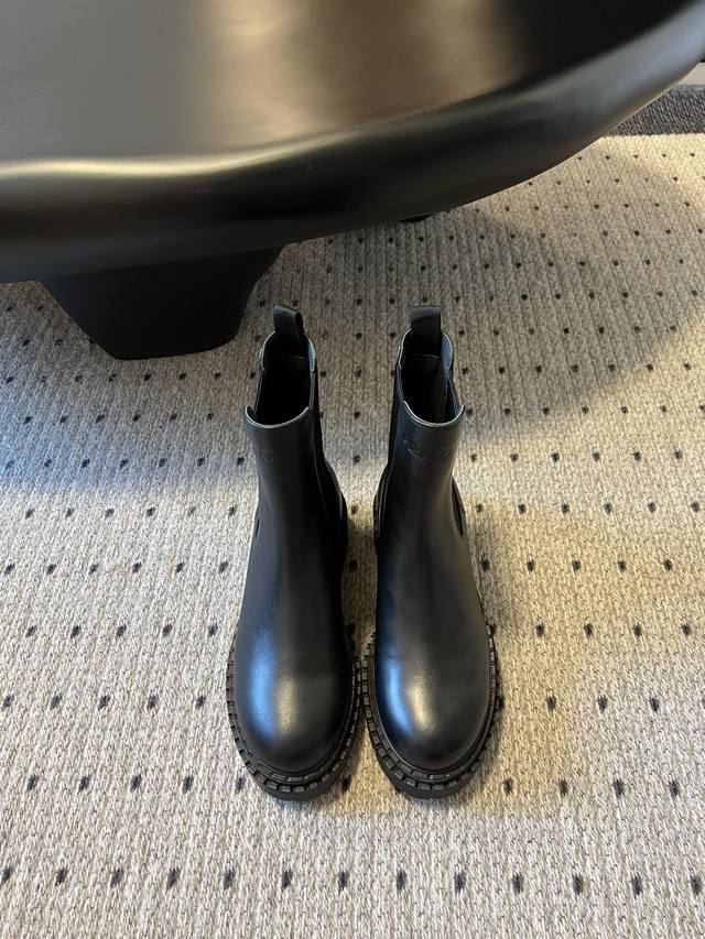 prad* Prada Thick-Sole Retro Chelsea Boots . These stylish, thick-soled, casual