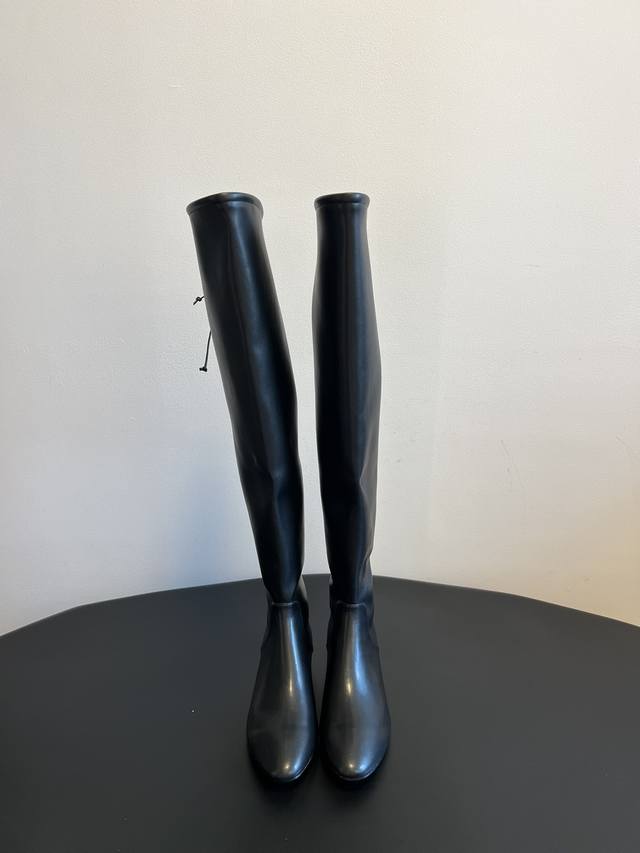 The Row's high-top, stretchy, over-the-knee leather boots are made from premium