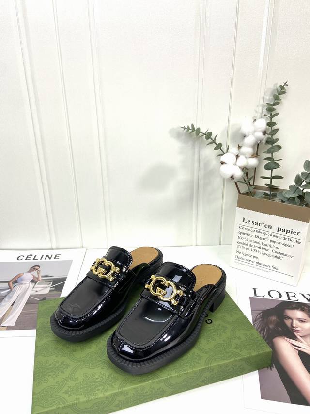 gucci | Gucci's latest autumn collection of large metal monogram buckle loafers,