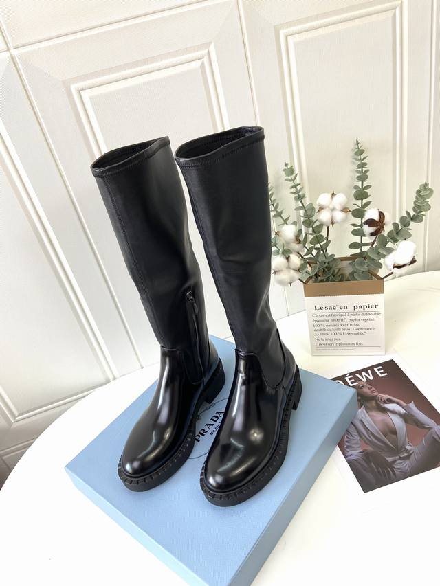 Sss relaunches Prada's latest stretch boots, . Prada's spring morning T-shirt i