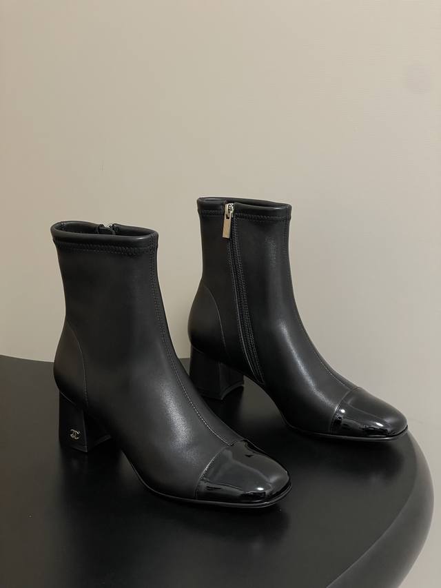 A timeless classic Chanel style. These square-toed, side-zippered stretch ankle