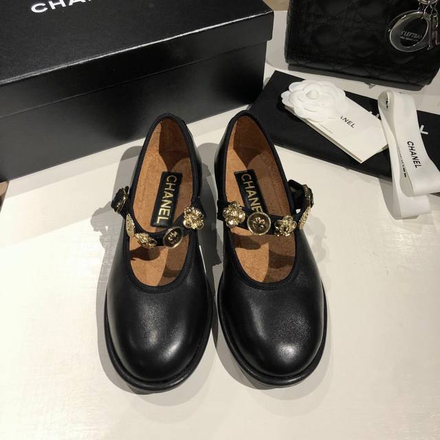 Chanel Chanel round-toe lambskin Mary Janes. Delicate camellia hardware accents
