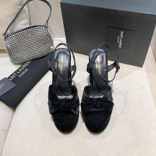 Saint Laurent's signature waterproof platform sandals are incredibly high, feat