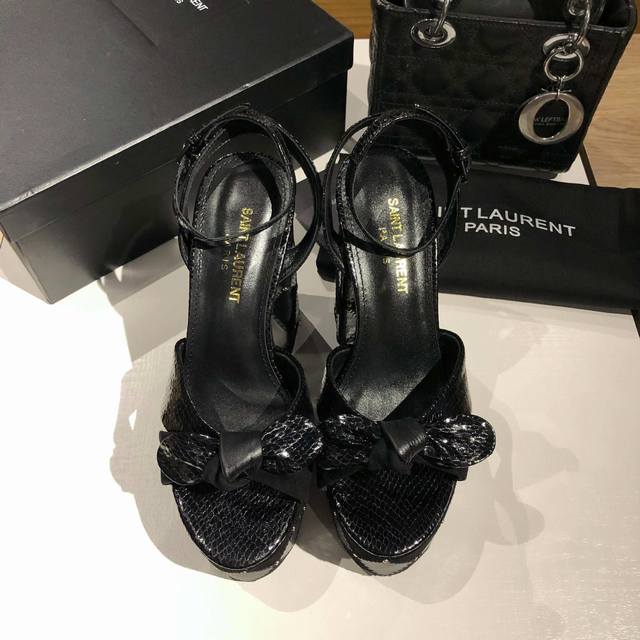 Saint Laurent 's signature waterproof platform sandals are incredibly high. Hig