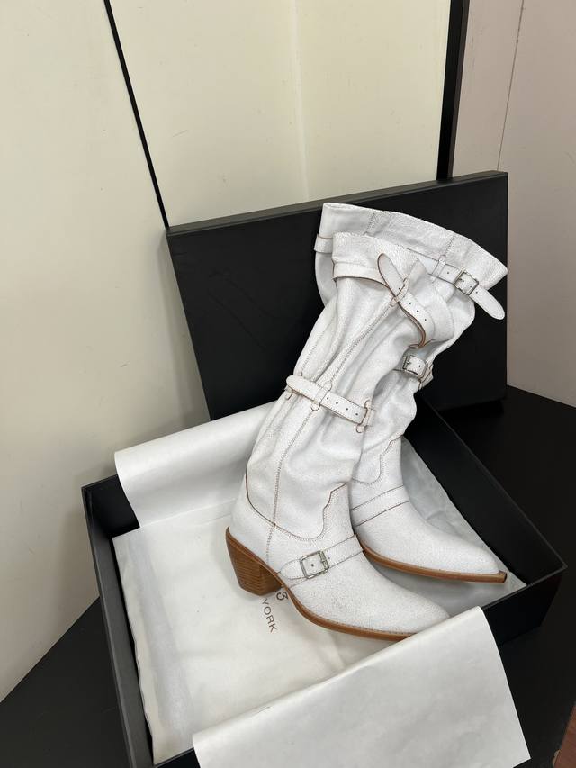 R13's new fall/winter mid-heeled knee-high boots. Design details: Western-inspir