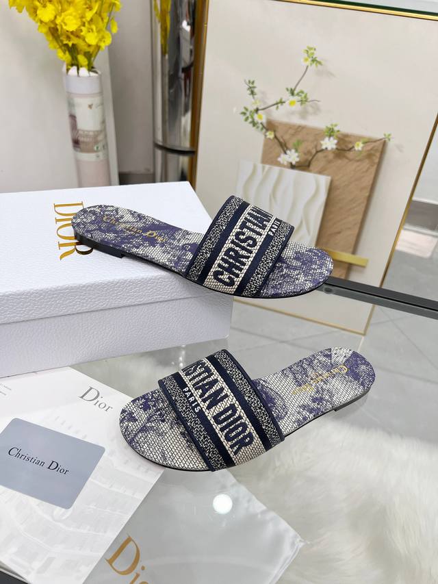 Dior Women's Monogram Embroidered Leather-Soled Slippers Christian Dior has alwa