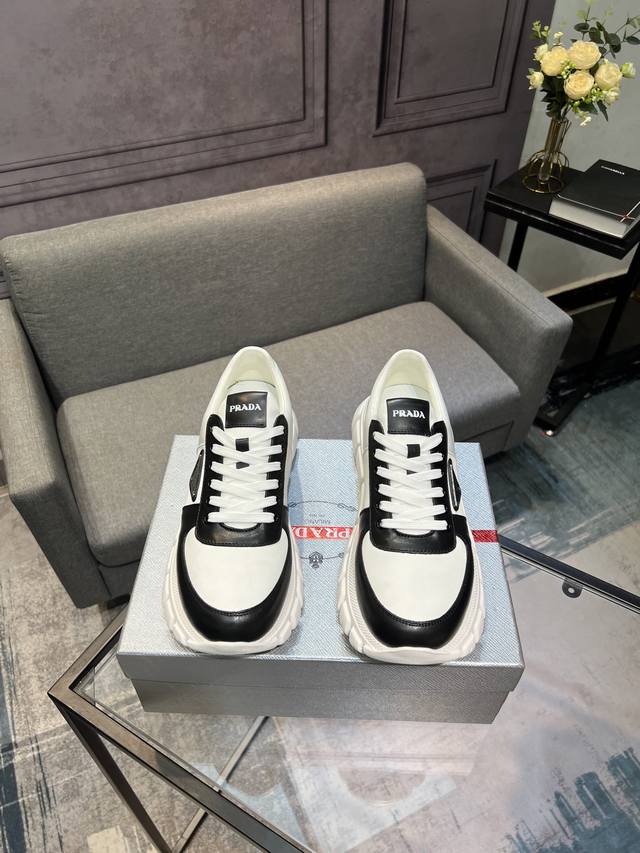 Prada men's shoes, a popular item in boutiques, synchronized with the official w