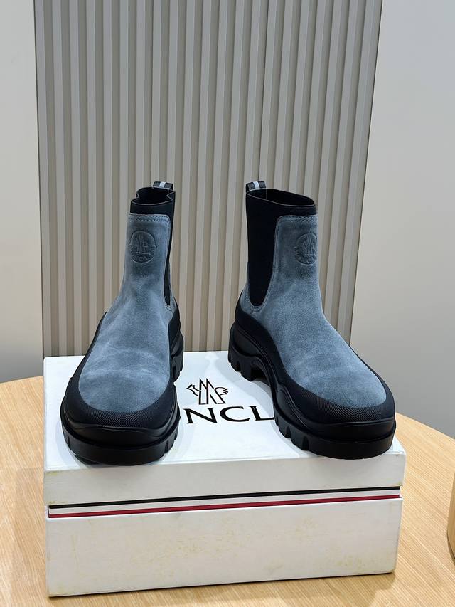 Moncler Men's High-Top Dr. Martens Shoes. Reinterpreting the brand's mountaineer Moncler Men's High-Top Dr. Martens Shoes. Reinterpreting the brand's mountaineer