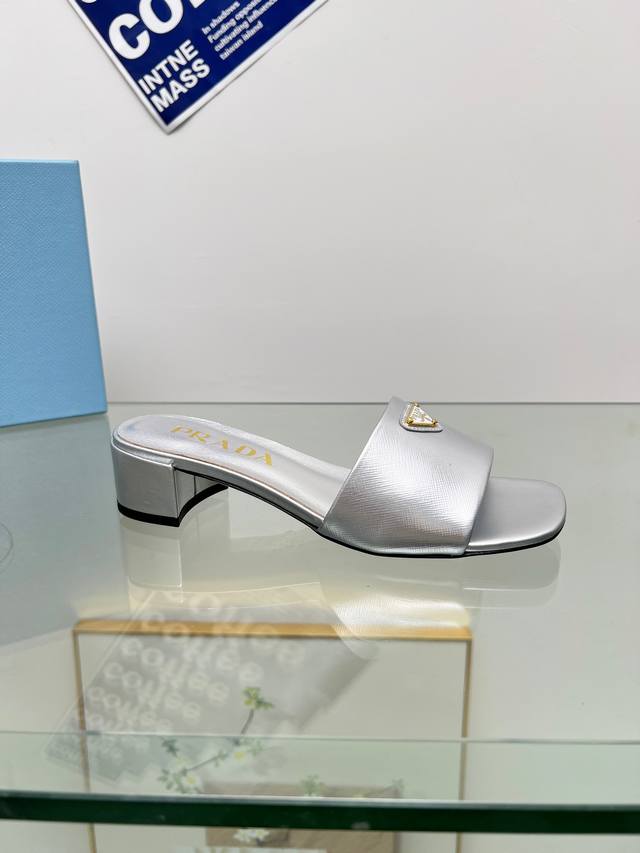 Prada's Spring/Summer Saffiano patent leather high-heeled mules have made a dazz