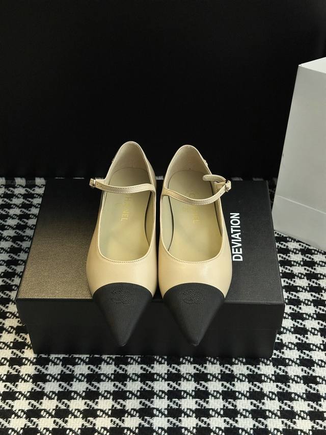 Chanel-style pointed-toe Mary Jane shoes. Elegance is etched into the design. Th
