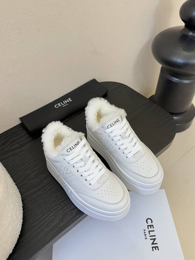 Celine Runner Cr-03 sneakers. The tongue and heel are decorated with the Celine