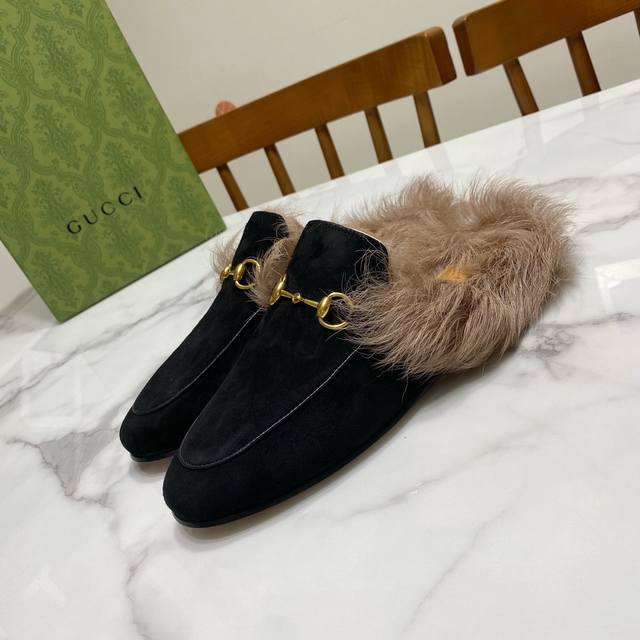 Gucci furry slippers, a wildly popular furry shoe in the fashion world, worn by