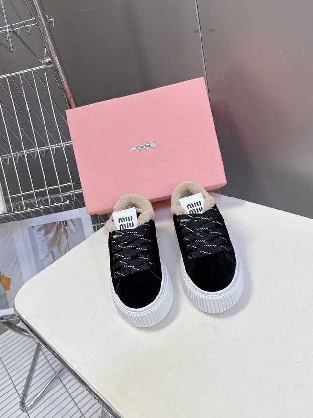 Miu Miu's latest Fall/Winter fuzzy biscuit-style platform shoes. Super popular w