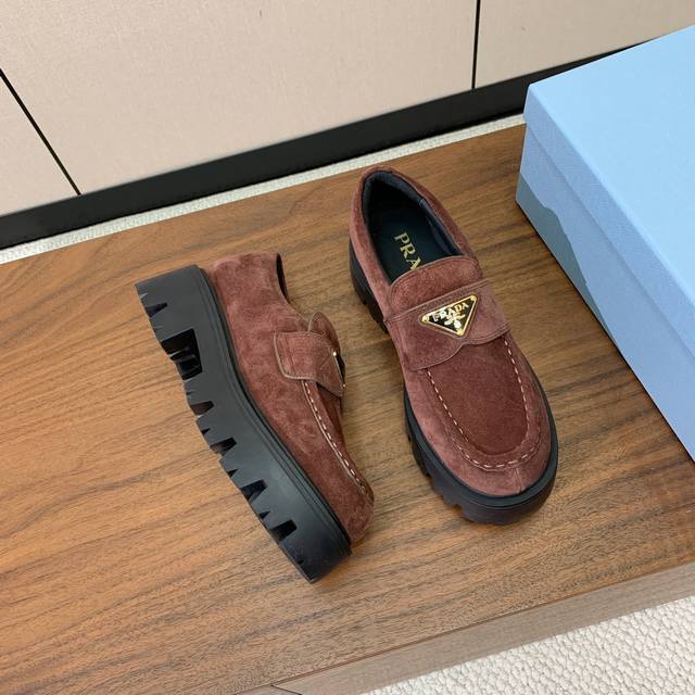 Prad* Triangle metal logo thick sole square toe slip-on. Popular among online ce