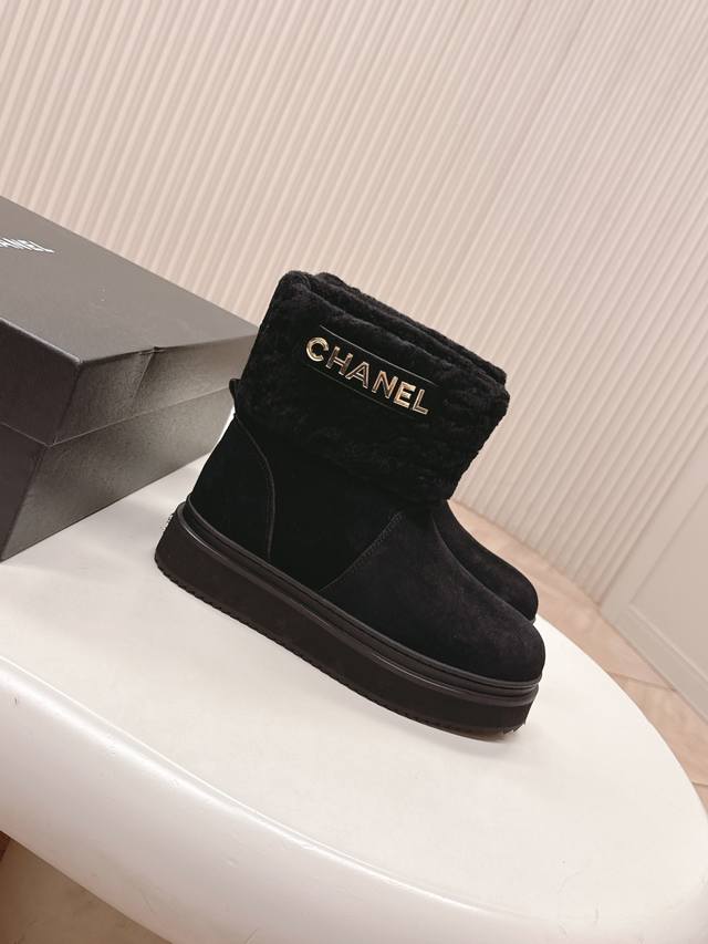 Chanel classic suede and wool boots, exuding a sophisticated and elegant style.