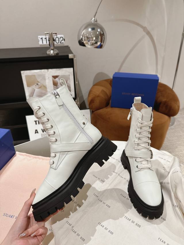 Dongguan-made Stuart Weitzman Soho knee-high boots feature a striking Soho groov