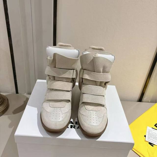 Isabel Marant's latest Fall/Winter high-top sneakers. A must-have for celebritie