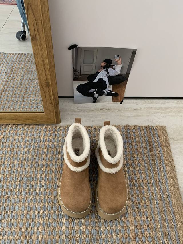 Thick-soled ankle boots with overflowing fur. Exquisite shoe design, stylish and