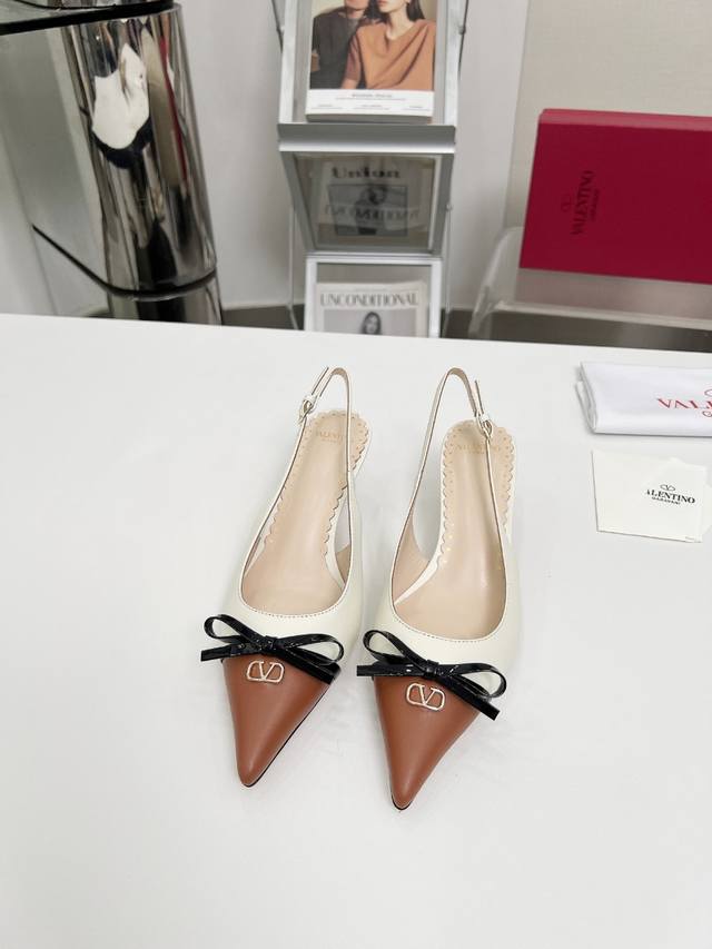 Top-tier version of Valentino Michele series. Features an open-back lace-up poin