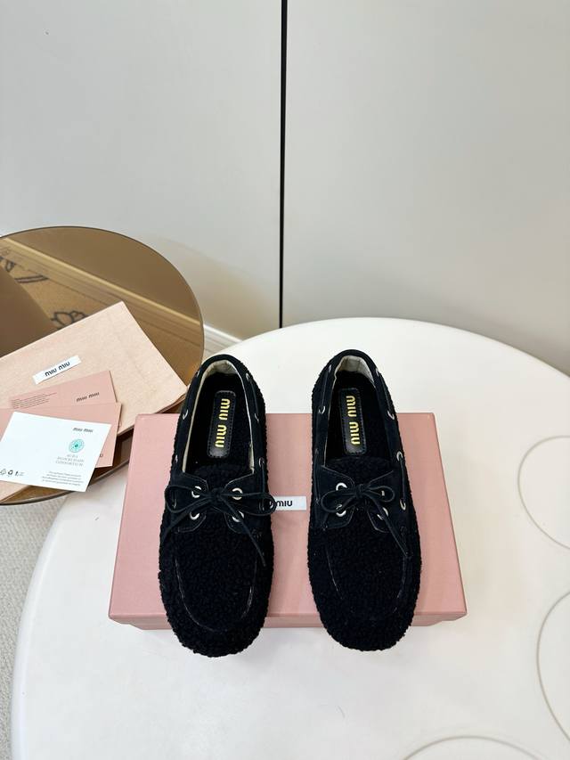 Miu Miu | Miu Miu Lambswool Maillard Style Loafers These white wool loafers from