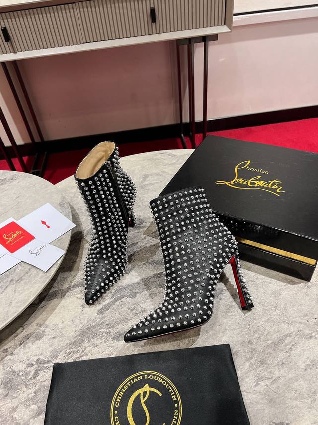 Banana Heel Spiked Boots W. Its beak-like point. This sophisticated style in bla