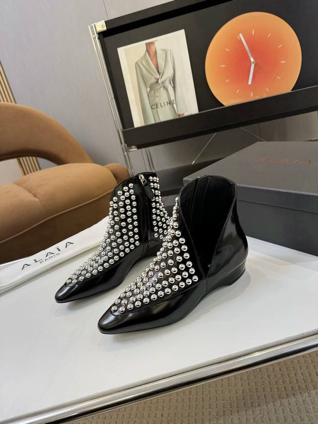 Price: Brand: Alaia Alaia 25 New Arrow Ankle Boots These pointed-toe ankle boots