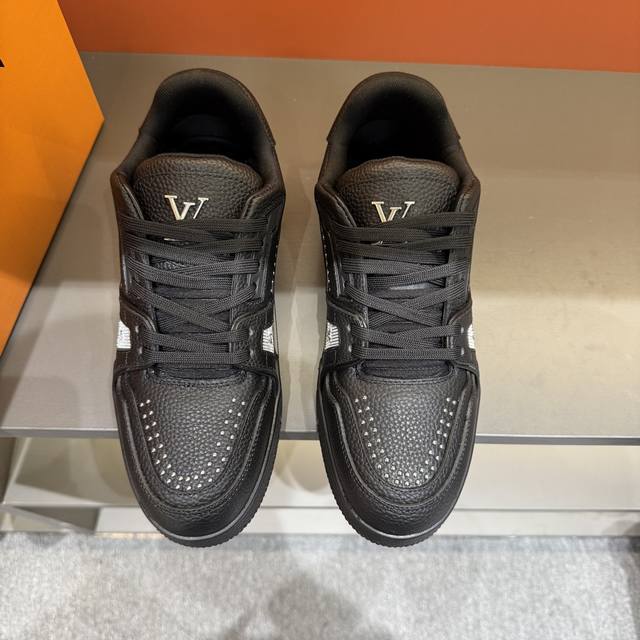 Sizes 38-45. This new colorway of the Louis Vuitton Trainer sneaker is crafted f