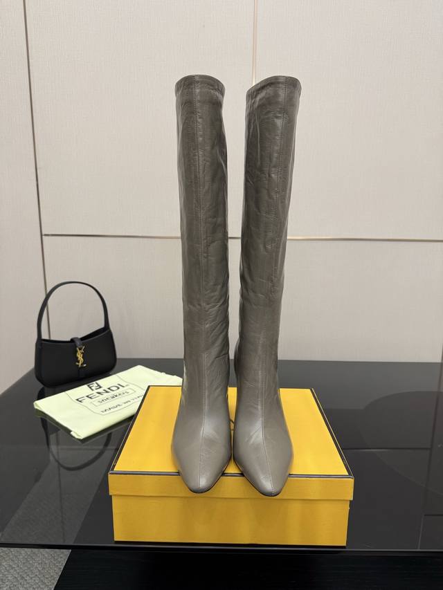 Fendi Arco Blind Eel Leather Boots These round boots feature a tapered toe and h Fendi Arco Blind Eel Leather Boots These round boots feature a tapered toe and h