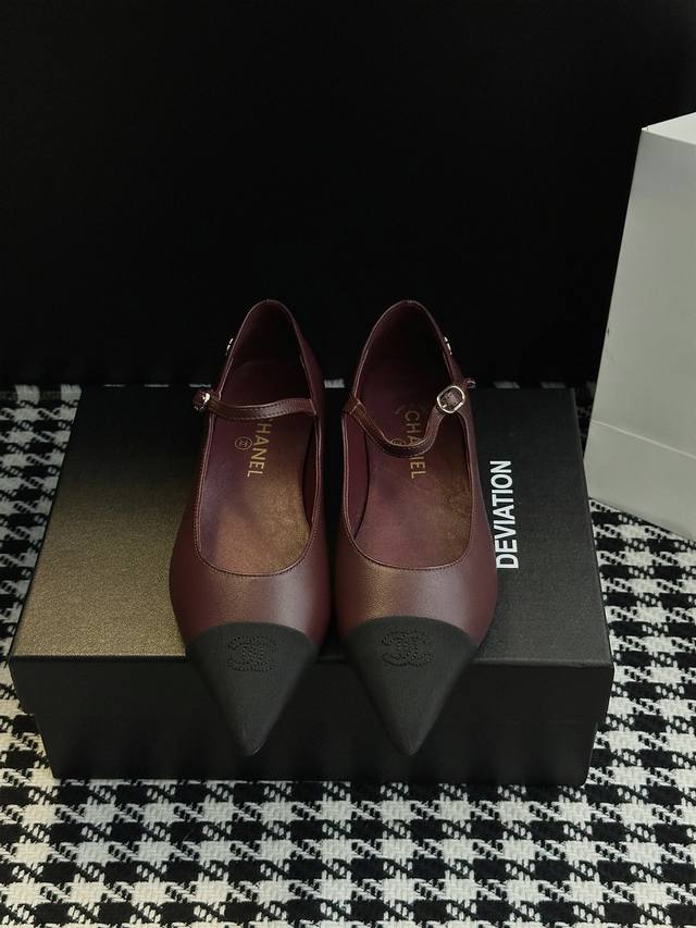 Chanel-style pointed-toe Mary Jane shoes. Elegance is etched into the design. Th