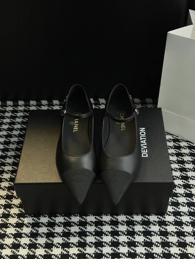 Chanel-style pointed-toe Mary Jane shoes. Elegance is etched into the design. Th