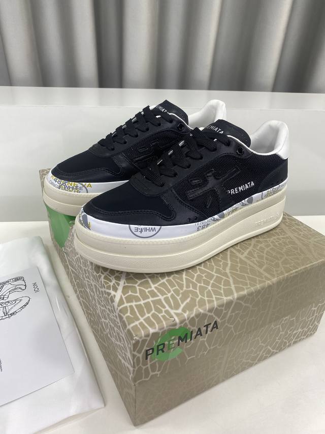 Premiata, a fashionable, sporty, casual, jogging, and white sneaker brand. Premi
