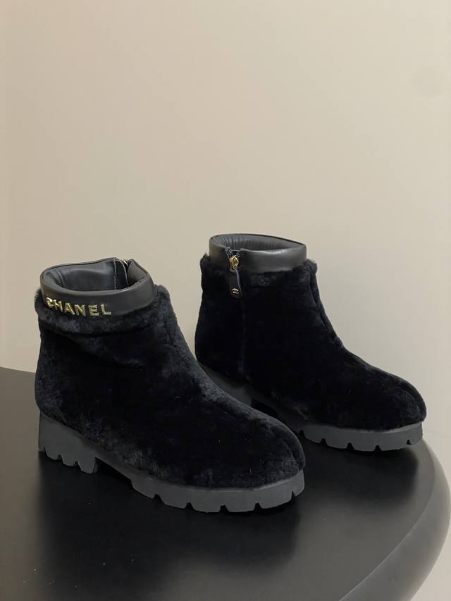 Chanel Classic Logo Buckle Fur Ankle Boots. When classic logos meet a warm, soft