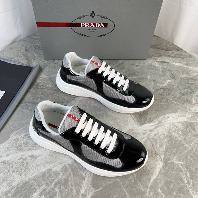 Classic P-brand design. Outer layer: Top-grain patent leather + brand mesh fabri