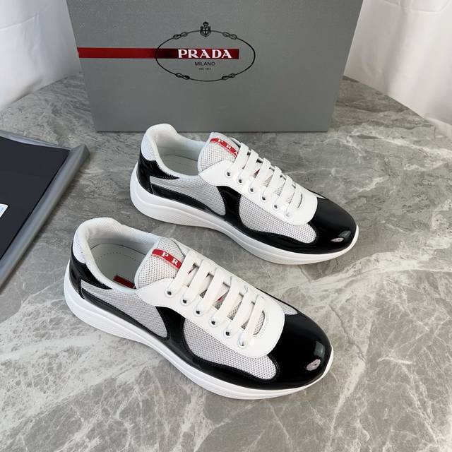 Classic P-brand design. Outer layer: Top-grain patent leather + brand mesh fabri