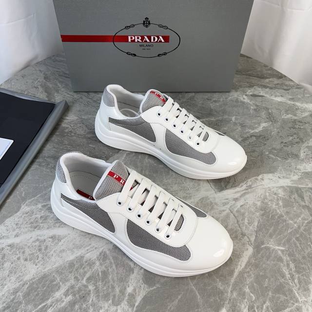 Classic P-brand design. Outer layer: Top-grain patent leather + brand mesh fabri