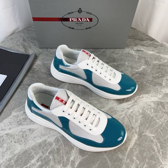 Classic P-brand design. Outer layer: Top-grain patent leather + brand mesh fabri