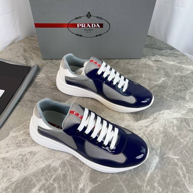 Classic P-brand design. Outer layer: Top-grain patent leather + brand mesh fabri