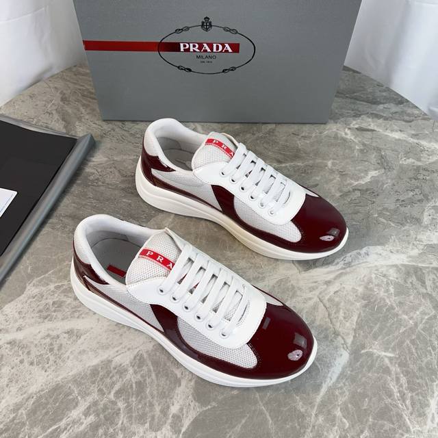 Classic P-brand design. Outer layer: Top-grain patent leather + brand mesh fabri