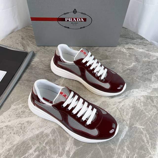 Classic P-brand design. Outer layer: Top-grain patent leather + brand mesh fabri