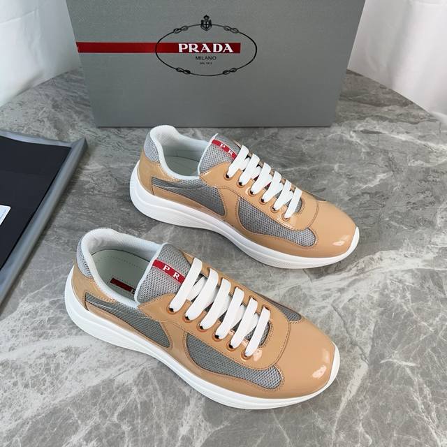 Classic P-brand design. Outer layer: Top-grain patent leather + brand mesh fabri